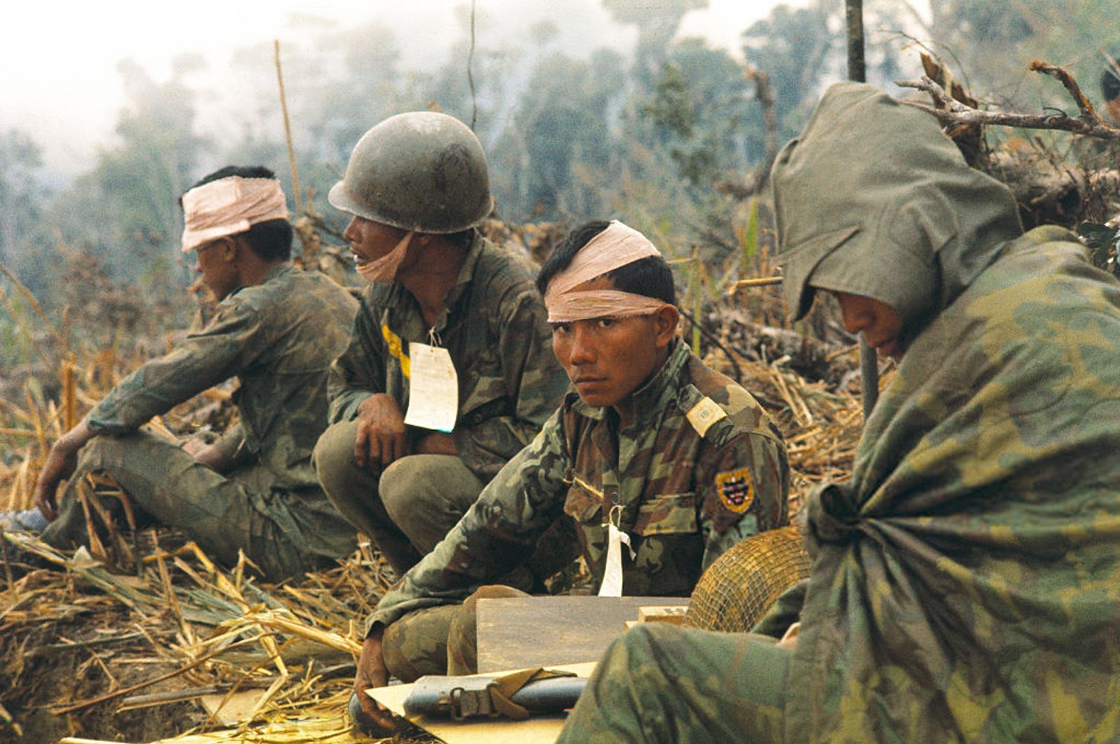Vietnam War 1971 - Wounded Vietnamese Rangers await medivac chopper
