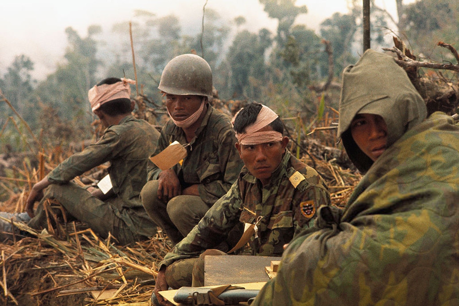 Vietnam War 1971 - Wounded Vietnamese Rangers await medivac chopper