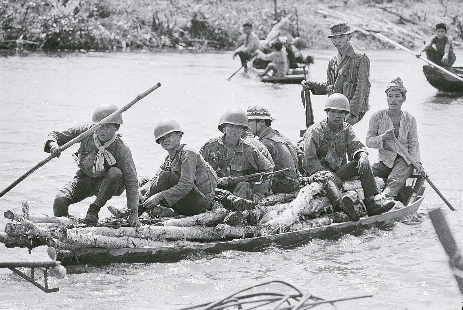 Soldiers Riding on Sampan of Logs 1971