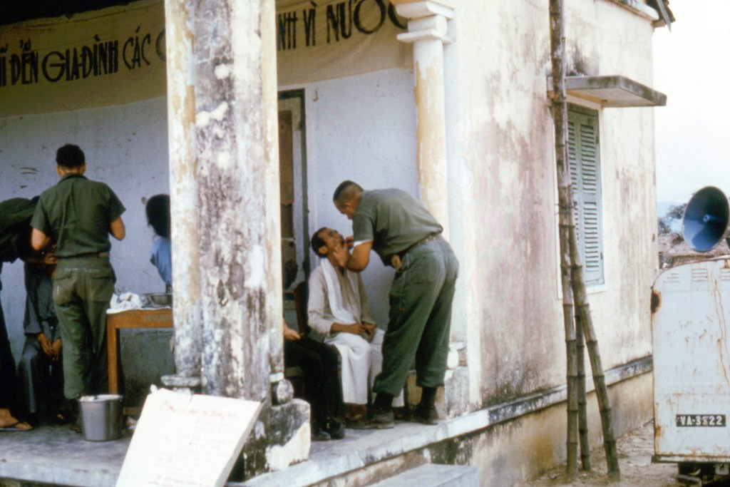 Extractions and sedative treatments are given in many places. This is a porch to a church, which has changed from Viet Cong to South Vietnamese hands numerous times.