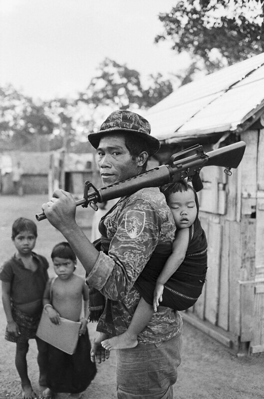 Vietnam War 1969 - Montagnard Soldier Carrying Baby