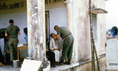 Extractions and sedative treatments are given in many places. This is a porch to a church, which has changed from Viet Cong to South Vietnamese hands numerous times.
