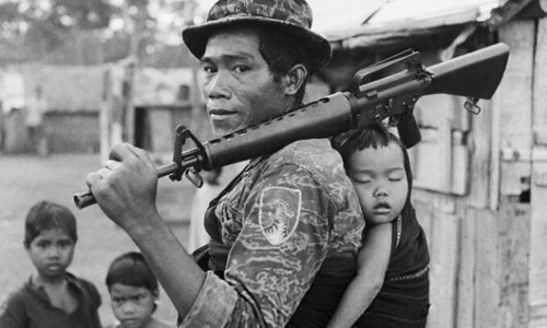 Vietnam War 1969 - Montagnard Soldier Carrying Baby