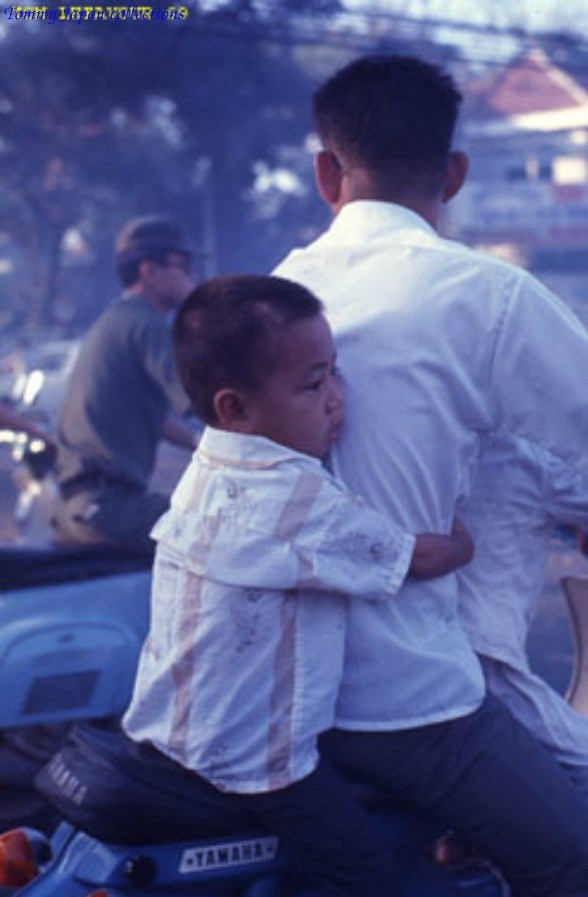Sleepy ride to school with Dad - Photo by Tom Lefavour