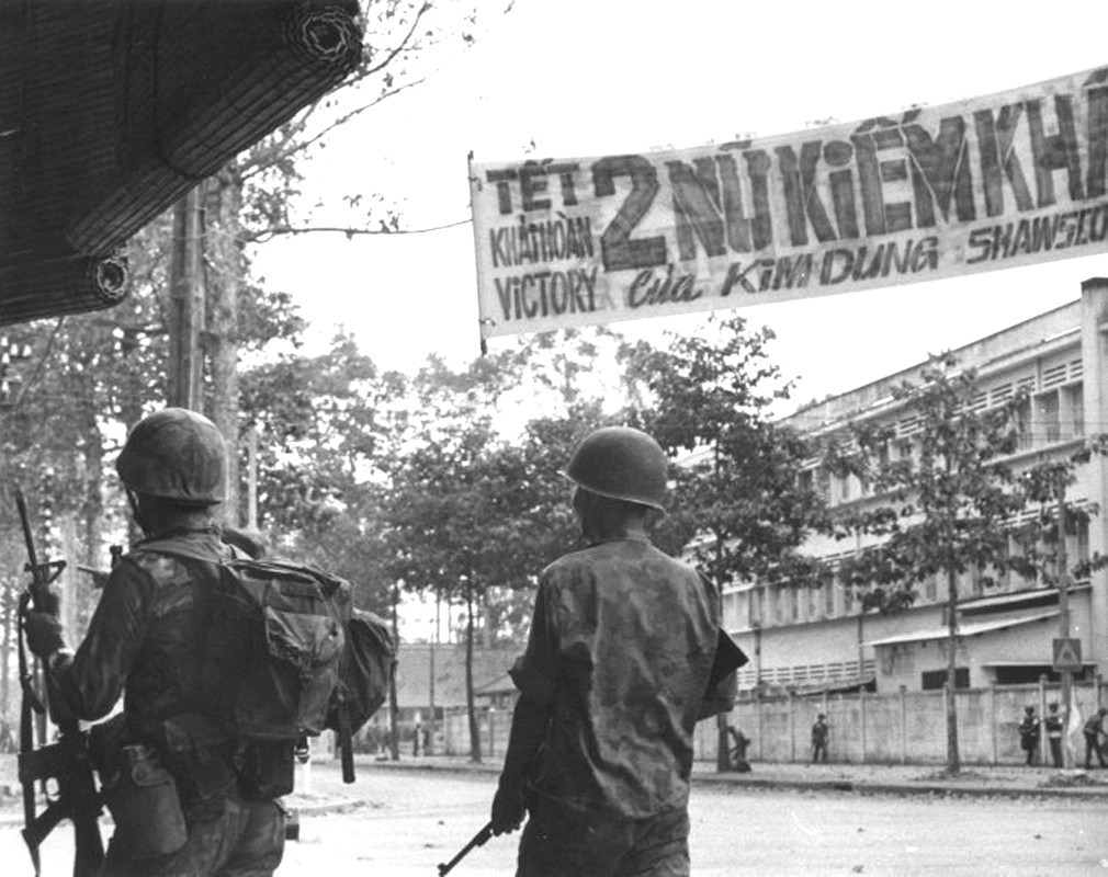 Army of the Republic of Vietnam (ARVN) soldiers search for Viet Cong snipers hiding out. Feb 1968 - Photo by Douglas Pike Collection