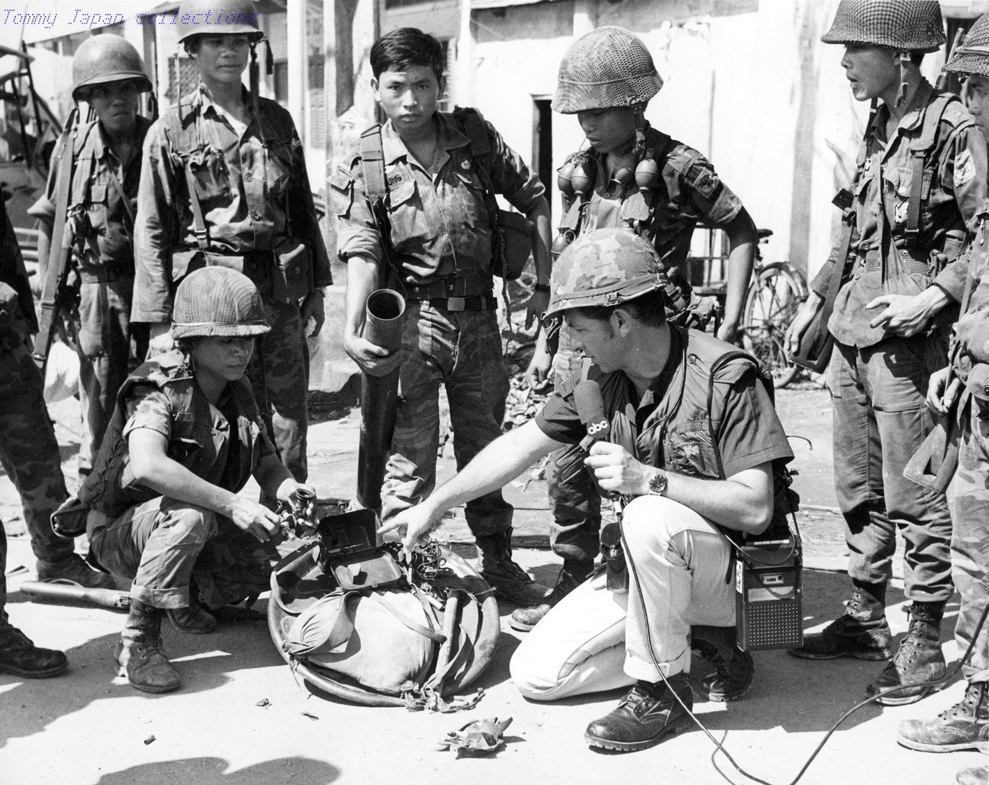 RVN Tan Son Nhut ARVN airborne soldiers display an 82mm mortar for ABC News reporter which they captured while on a sweep in the area surrounding the Old French Cemetery on Plantation Road. 7 May 1968