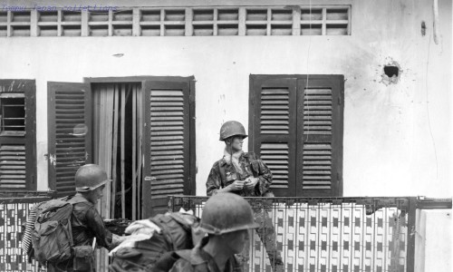 RVN Saigon Members of the 7th Bn., ARVN Airborne lay down ina field of M-60 fire and lob hand grenades into a VC position during the fighting in the village of Tan Son Nhut Air Base. 6 May 1968