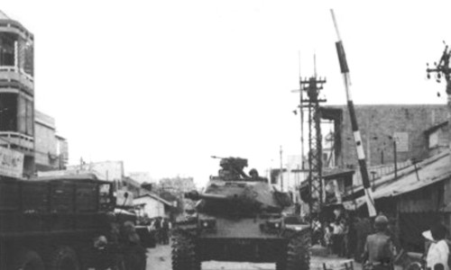 Vietnamese armor moves into the rail crossing area of Phu Nhuan section near Tan Son Nhut