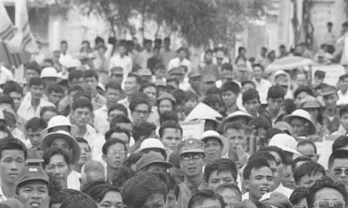 1967 - Vietnamese crowd attending political rally in My Tho. Many soldiers are in crowd